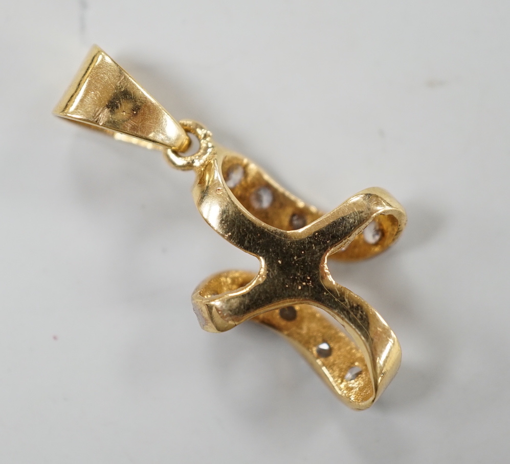 A modern yellow metal and simulated diamond cluster set drop pendant, 25mm